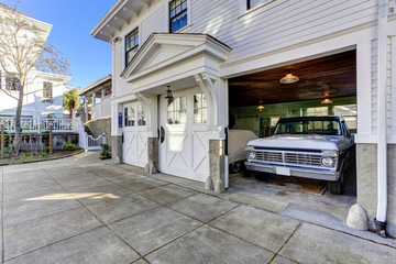 House exterior. View of garage and driveway - obrazy, fototapety, plakaty