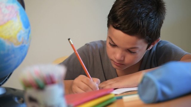 Child writing at school