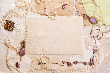 old paper sheets surrounded by retro women's accessories
