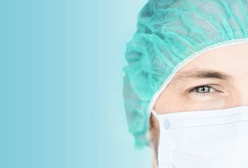 surgeon in medical cap and mask