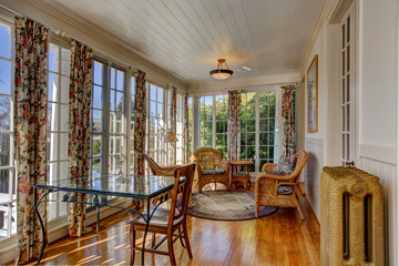 Bright sunroom with wicker furniture