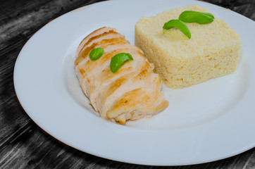 Grilled chicken breast with couscous and basil