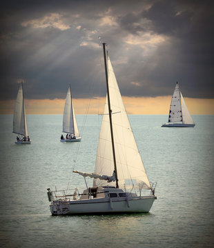 The Sailboats on a sea. Retro style picture.