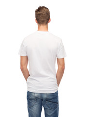 Fototapeta premium young man in blank white t-shirt from back