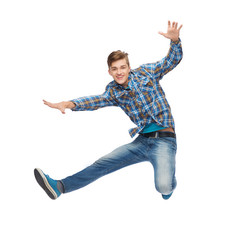 smiling young man jumping in air