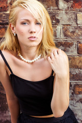 Fototapeta premium beautiful blonde girl with blue eyes on the streets