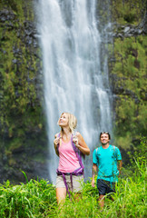 Couple hiking to waterfall