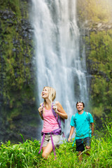 Couple hiking to waterfall