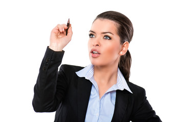 Attractive businesswoman writing a plan
