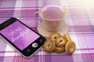 Mobile phone coffee cup and donuts