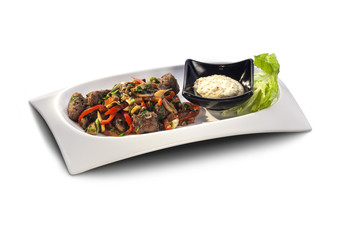 meat balls and with vegetables on a plate