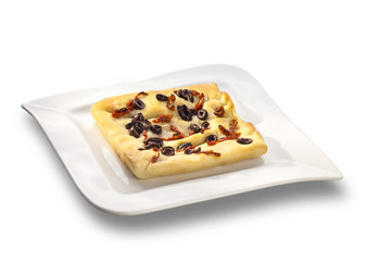 Over baked gourmet flat bread with olives and roasted tomatoes