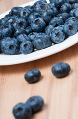 Blueberries on the wooden table.