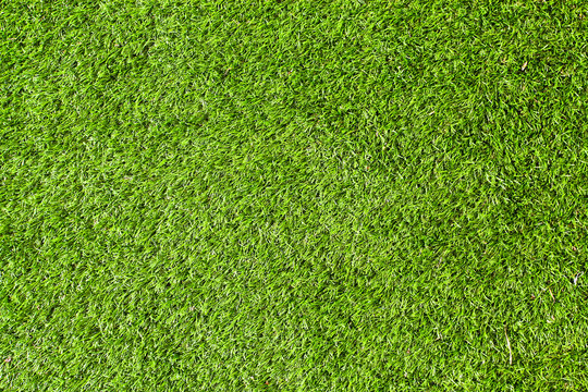 Green background of football field grass texture