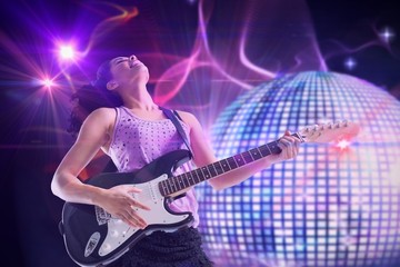 Composite image of pretty girl playing guitar