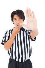 Stern referee showing stop sign with hand