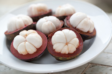 tropical mangosteen fruit on wood table