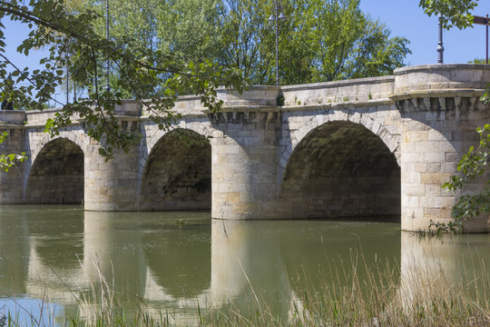 famous stone bridge, Puente Mayor, XVI Century, in Palencia, Spa