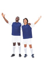 Fototapeta premium Football players in blue celebrating