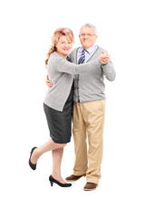 Full length portrait of a mature couple dancing tango