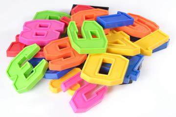 Fototapeta premium Colorful plastic numbers on a white