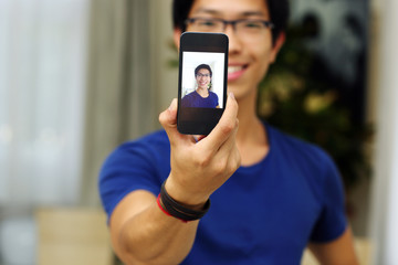 Handsome asian man at home