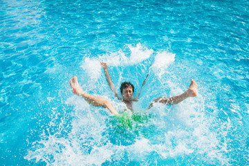 Obraz na płótnie Canvas Man falling and splashing into water