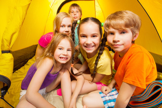 Close-up picture of kids in tent