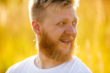 Cheerful blond bearded man in т-shirt