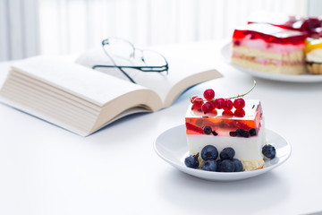 Time for something sweet. Cake with jelly on the table.