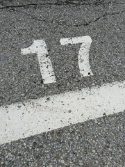 Number seventeen written on the road