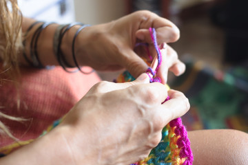 a girl crocheting