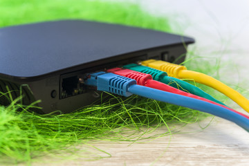 network switch with various color RJ45 cables connected for swit