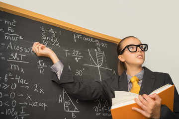 Student at the board solves the problem