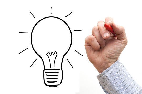 Male hand drawing light bulb over a White Background
