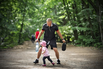 Small girl tries to pass by her father and escape