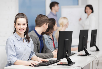 Obraz premium students with computer monitor at school