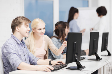 students with computer monitor at school