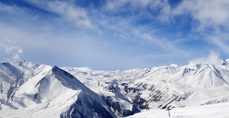 Fototapeta na wymiar Panorama of winter snowy mountains at nice day