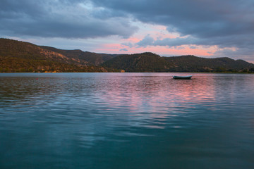 Boat on reservoir at dusk