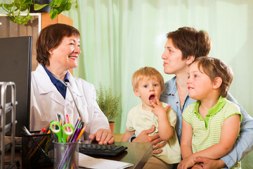  mother of two children  talking with friendly  doctor