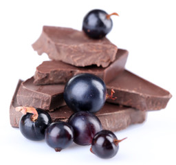 Summer berries and chopped chocolate isolated on white