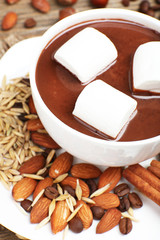 Cup of hot chocolate on table, close up