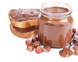 Sweet chocolate cream in jar isolated on white