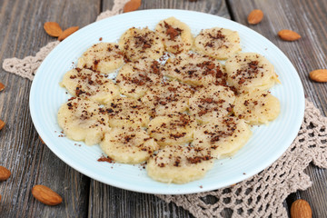 Sweetened fried banana on plate, close-up