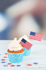American patriotic holiday cupcakes on wooden table