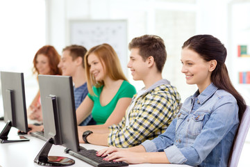 female student with classmates in computer class