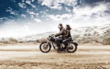 Fototapeta na wymiar Active couple on the motobike