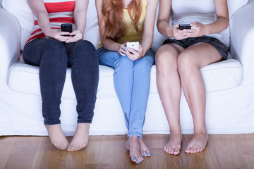 Girls using phones on meeting