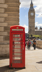 Fototapeta na wymiar London, Phone box in Westminster, red symbol of Great Britain